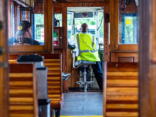 trolley bus well dressed professional chauffeurs